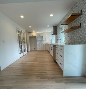 Completed Lion Heart open kitchen with light hardwood flooring