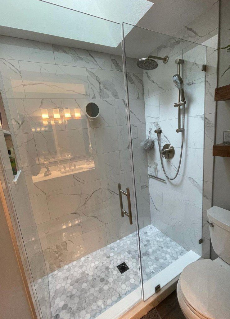 Completed Lion Heart walk-in shower with a hexagon mosaic floor