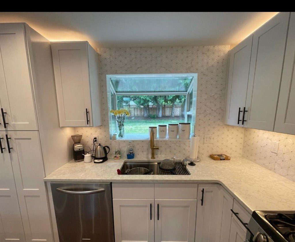 Completed Lion Heart white kitchen with a garden window