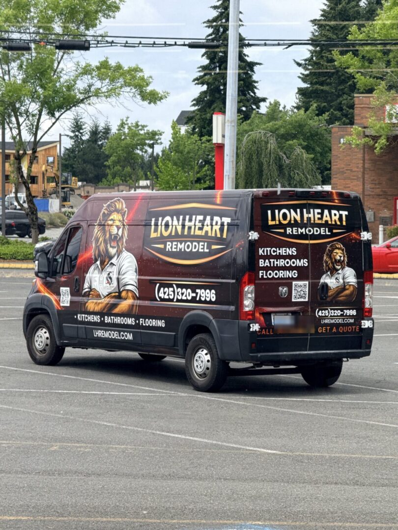 The wrapped Lion Heart Remodel work van with the gold shield wordmark and lion mascot.