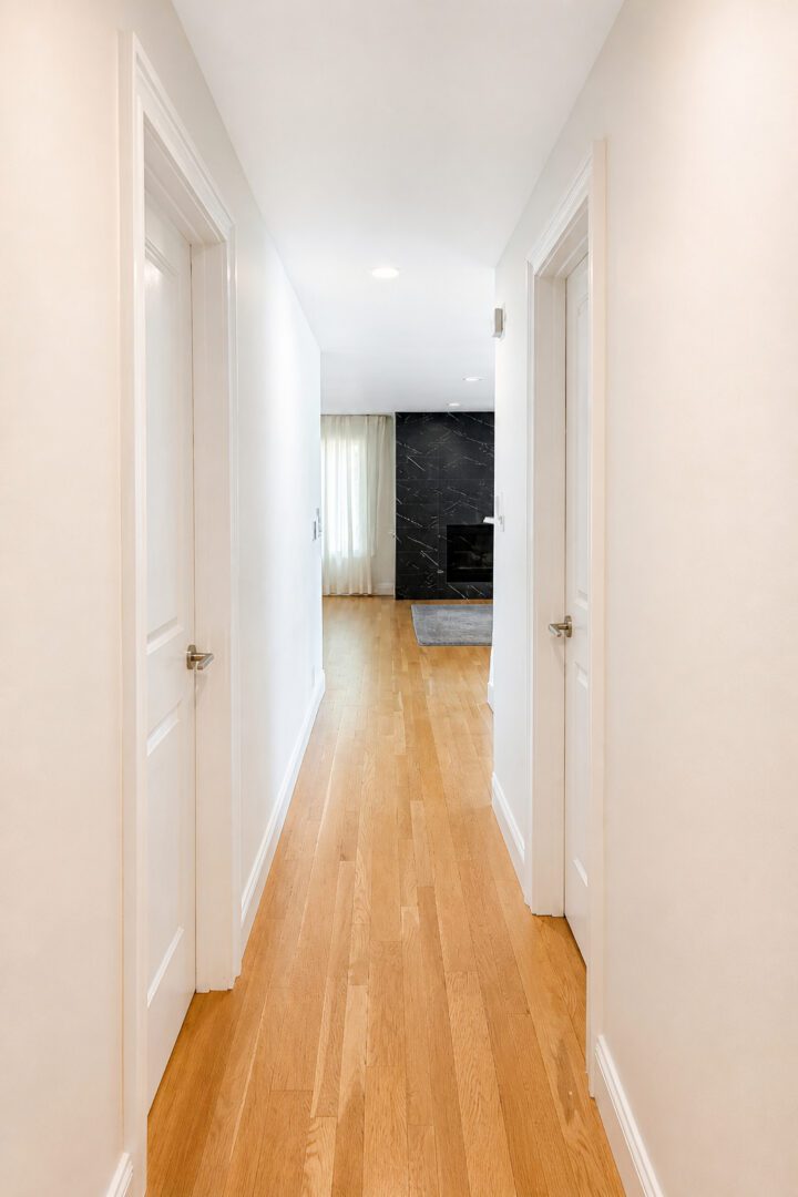 Completed Lion Heart hardwood hallway and new interior doors.